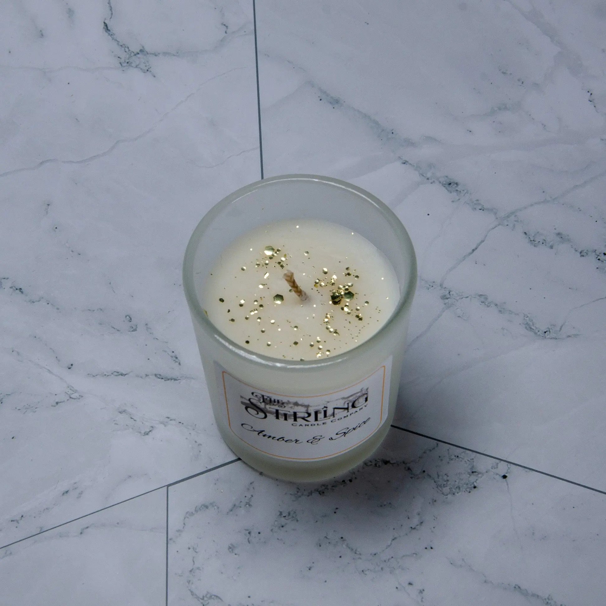 Small Amber & Spice candle with gold glitter, hand-poured in Scotland, sustainable rapeseed coconut wax