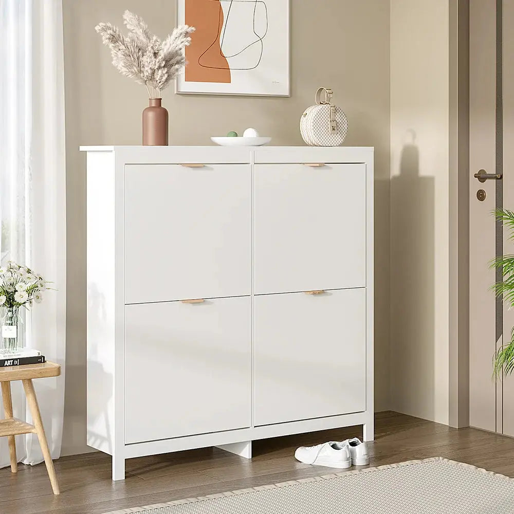 White flip down wood shoe cabinet with 4 shelves in a modern hallway. Space-saving storage solution.