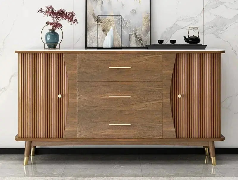 Modern minimalist wooden showcase cabinet with fluted doors, three central drawers, and golden legs.