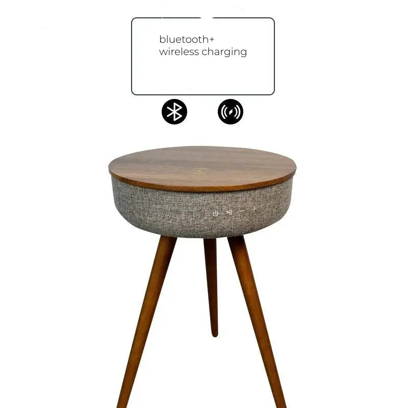 Round smart coffee table with wooden top, grey fabric side, and wooden legs, showing Bluetooth and wireless charging features