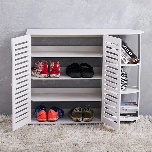 White 4-layer double door shoe cabinet with open shelves. Shoes are stored inside and books on the side.
