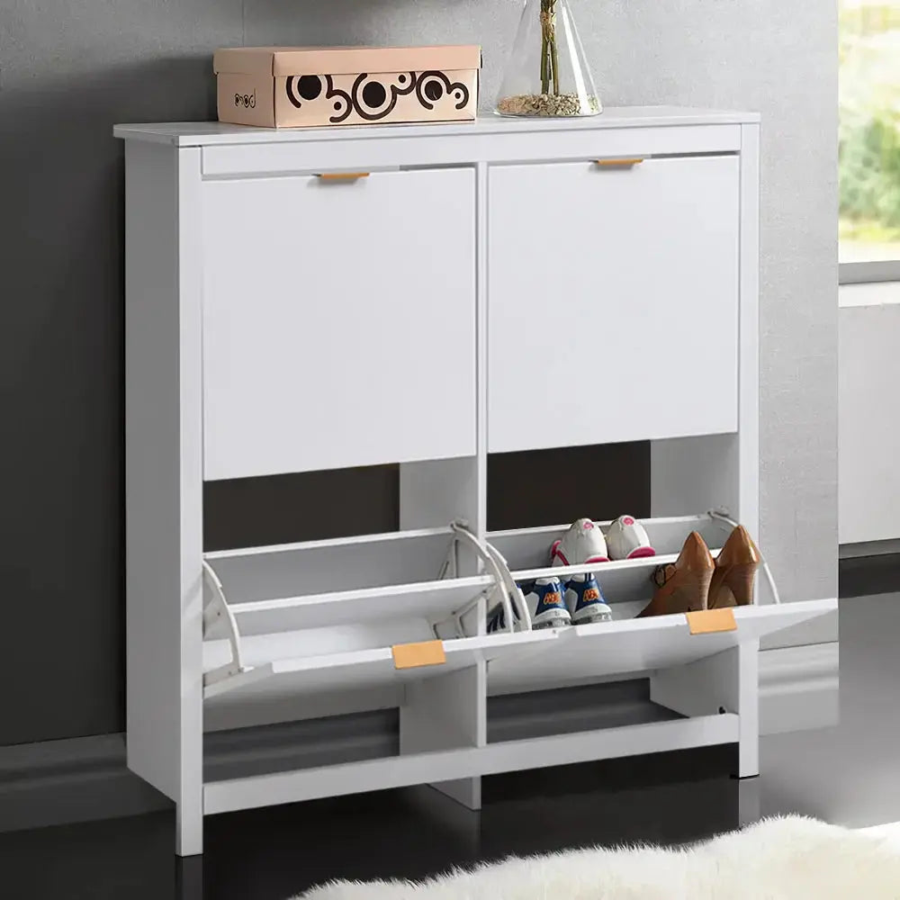 White flip-down wood shoe cabinet with four shelves, holding shoes, in a modern entryway