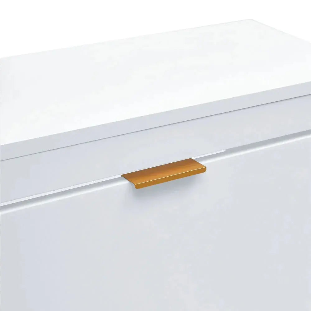 Close-up of a white flip-down wood shoe cabinet with a sleek brass-coloured handle.