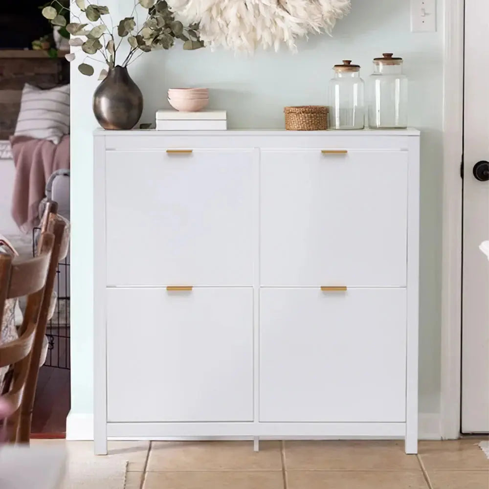 White Flip Down Wood Shoe Cabinet with 4 shelves & gold handles, styled in a modern entryway with decor