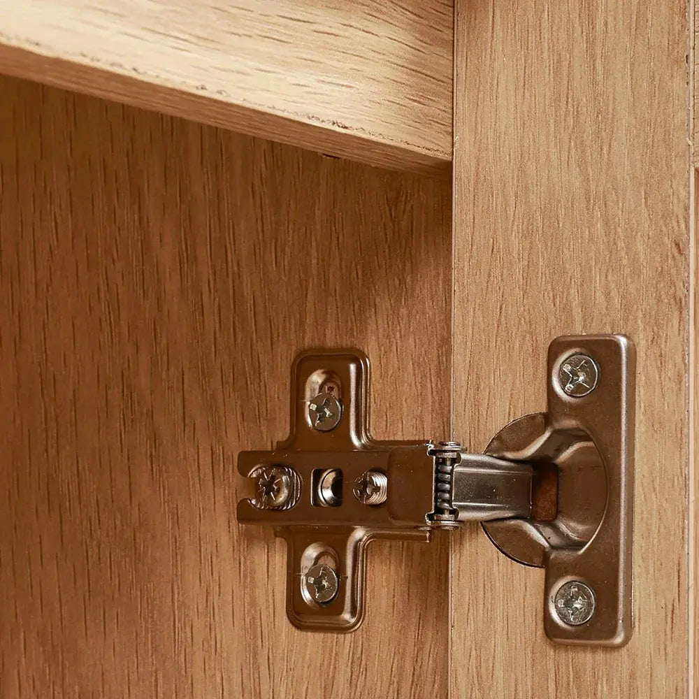 Close-up of a silver door hinge on the interior of the wooden rattan sideboard, showcasing craftsmanship.