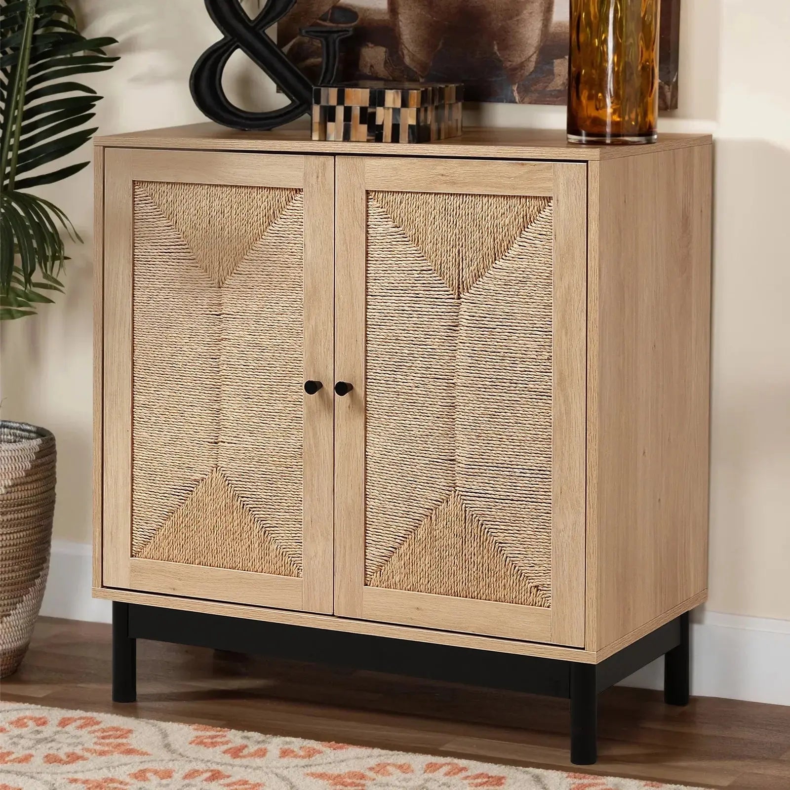 Rattan double door wooden sideboard with woven pattern, black legs, and light wood finish in a living room