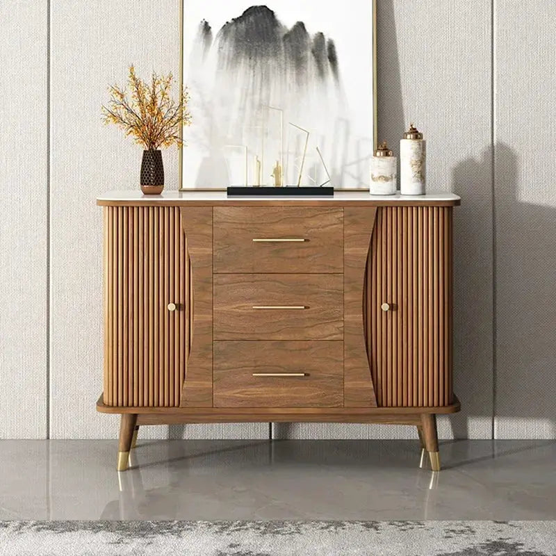 Modern minimalist wooden showcase cabinet with fluted doors, three central drawers, and white slate top for storage