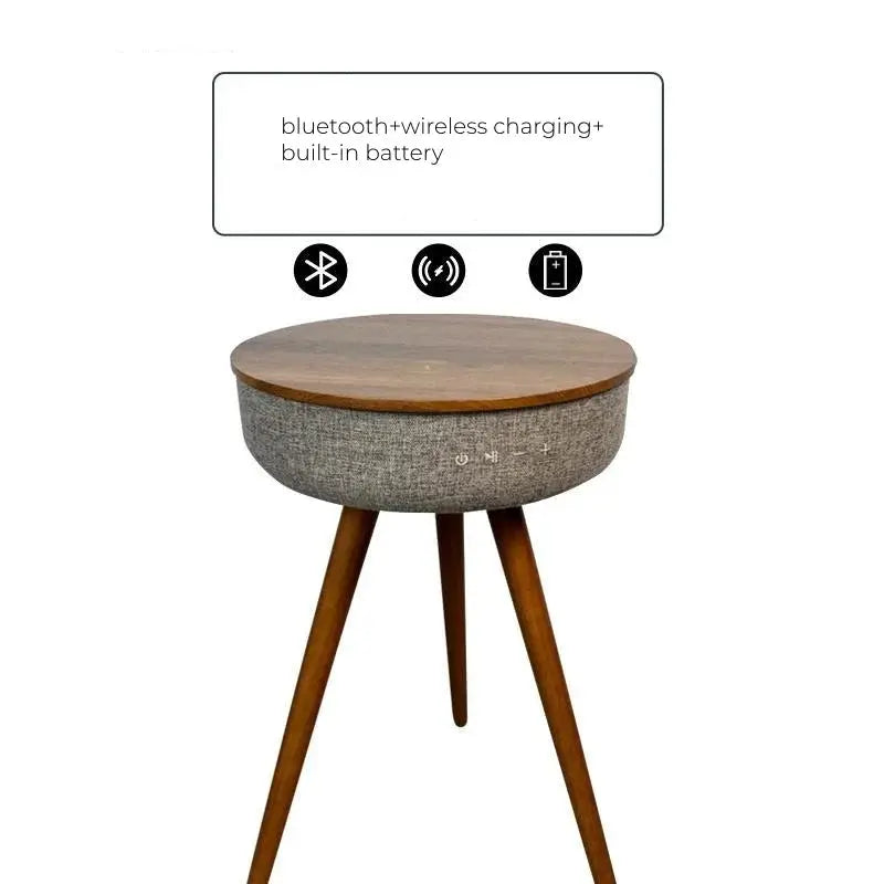 Round smart coffee table with wooden top, grey fabric base with controls, and wooden legs.