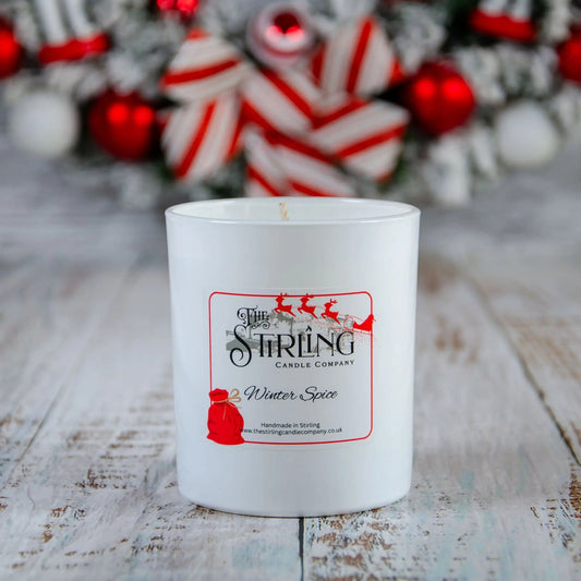 Winter Spice large candle by The Stirling Candle Company with festive background, handmade in Scotland