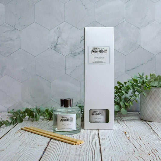 Fairy Dust 100ml reed diffuser and packaging box with reeds, featuring Stirling Candle Company label. Vegan home fragrance.