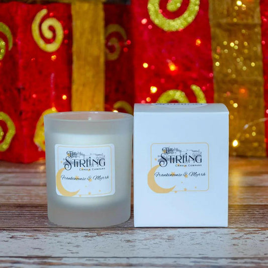Frankincense & Myrrh medium candle in a frosted glass jar next to its white box. Scottish handmade luxury candle.