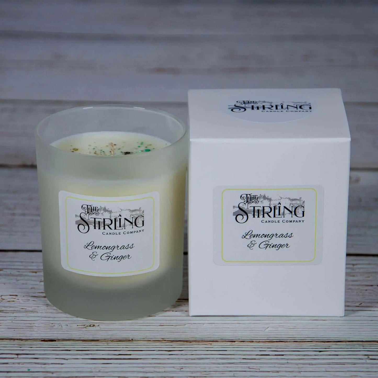 Lemongrass & Ginger medium candle with white label and matching white box, both displaying Stirling Candle Company branding.