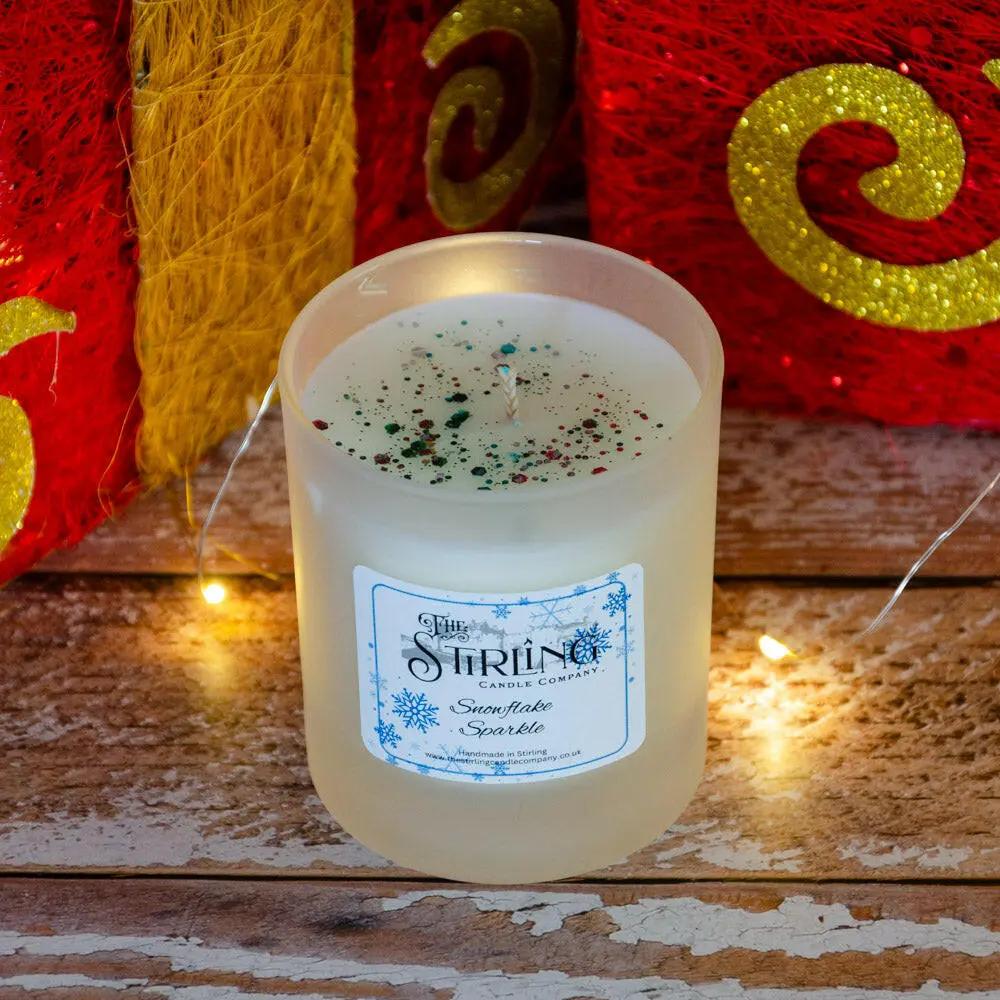 Snowflake Sparkle medium candle, hand-poured in Stirling, Scotland, with visible glitter on top and label showing name