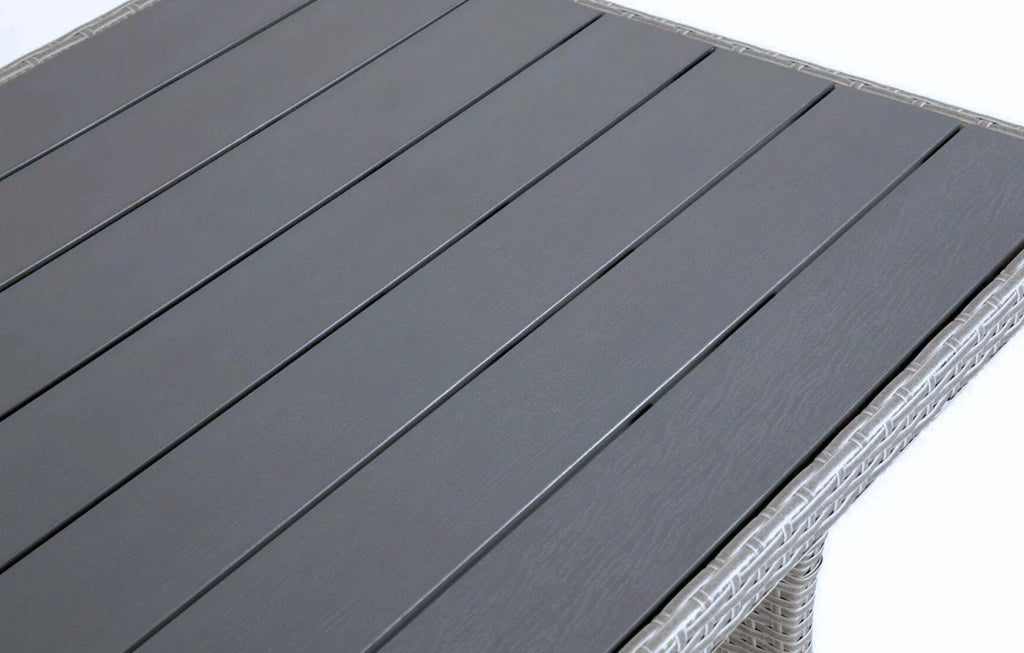 Close-up of Stockholm 6 Seater Grey Rattan Corner Garden Dining and Lounge Set table top with grey slats and rattan edge