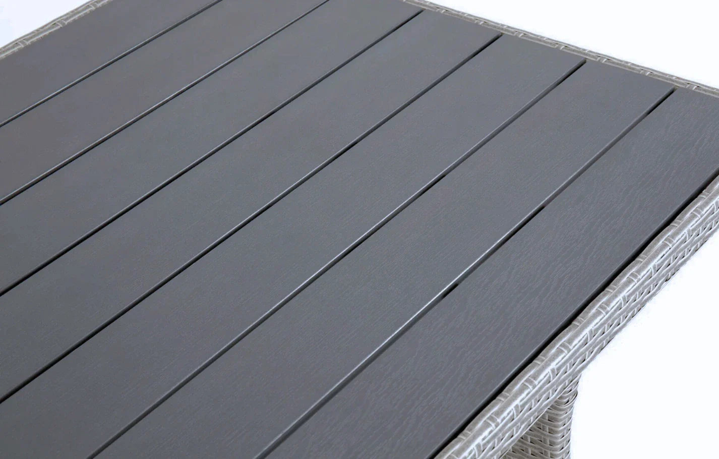 Close-up of Stockholm 6 Seater Grey Rattan Corner Garden Dining and Lounge Set table top with grey slats and rattan edge