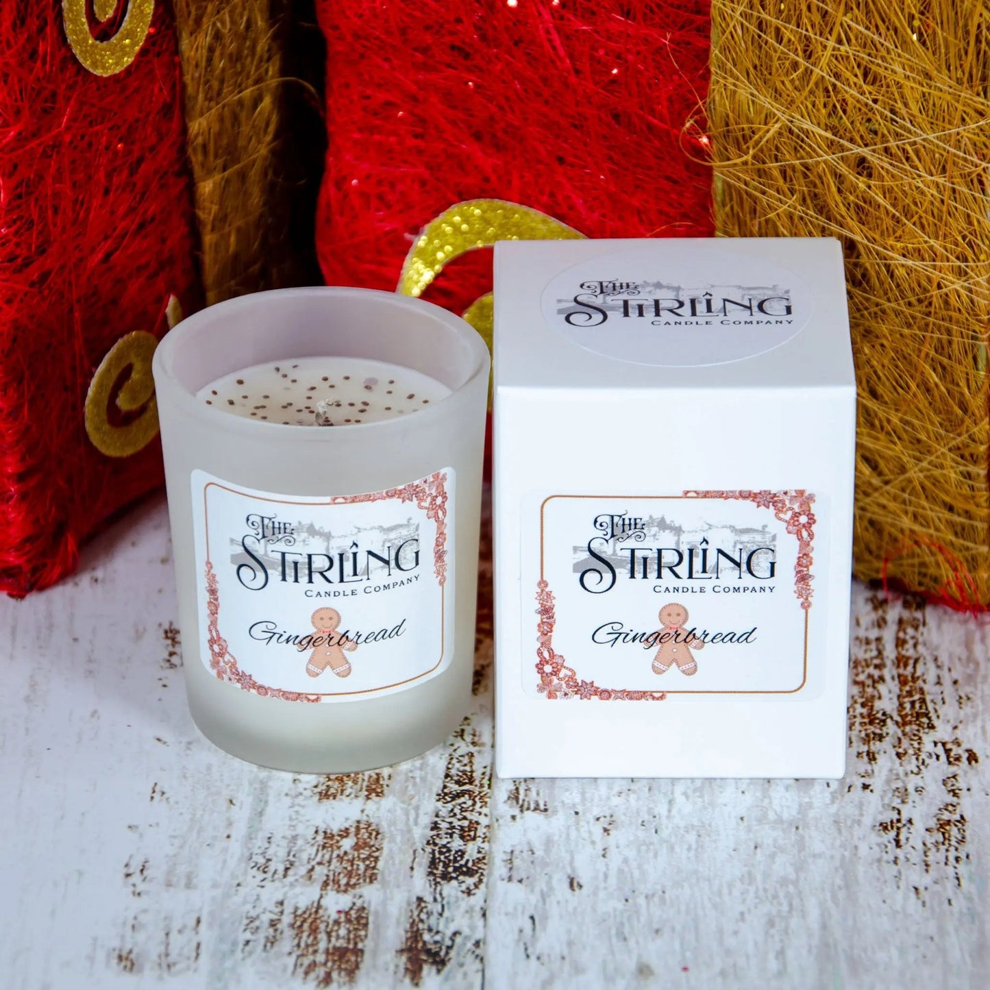 Gingerbread small candle by The Stirling Candle Company next to its white packaging box.