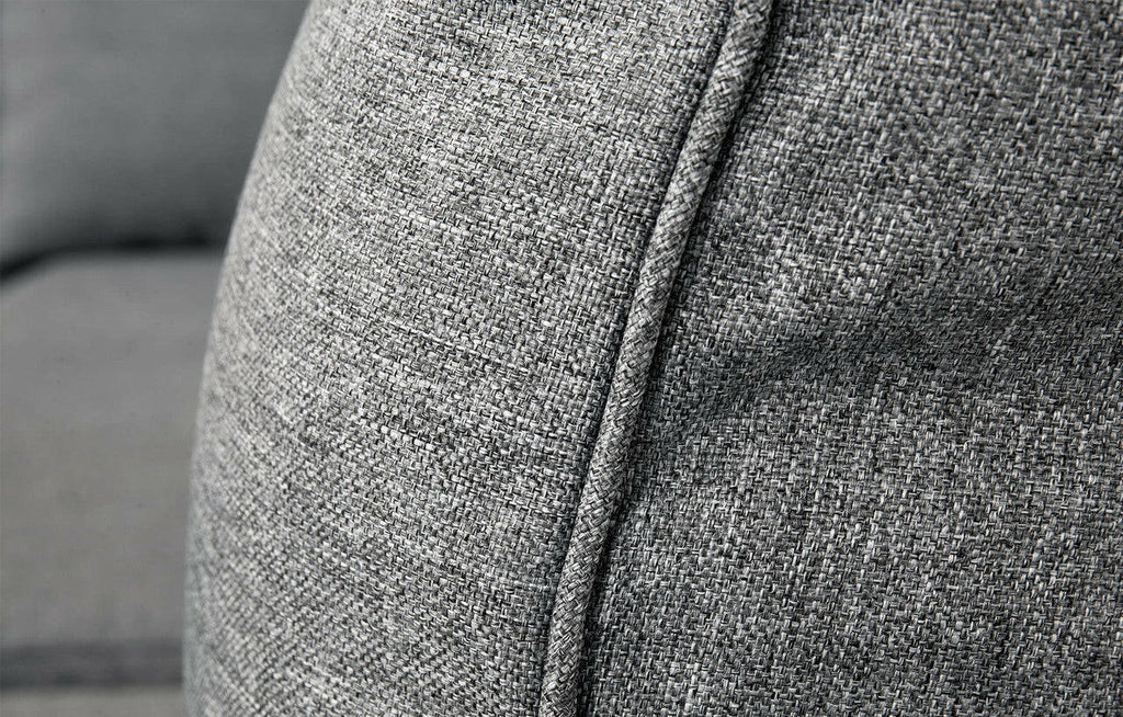Close-up of Palma Grey Rattan corner sofa fabric texture and piping detail, showcasing quality material.