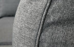 Close-up of Palma Grey Rattan corner sofa fabric texture and piping detail, showcasing quality material.