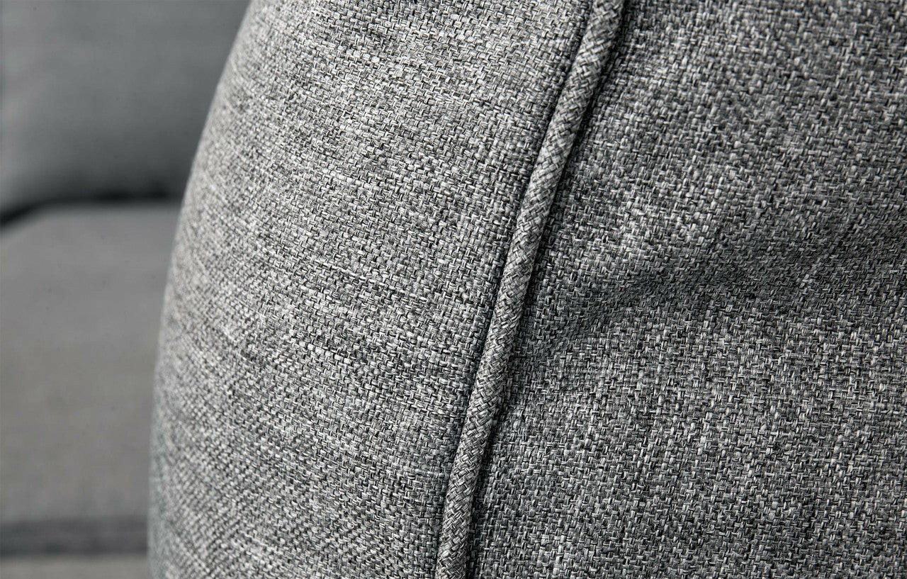Close-up of Palma Grey Rattan corner sofa fabric texture and piping detail, showcasing quality material.