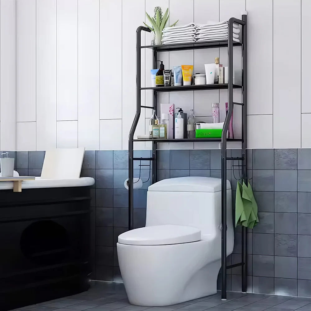 Black 3-tier over toilet storage rack with toiletries and towels in a modern bathroom, space-saving organiser.