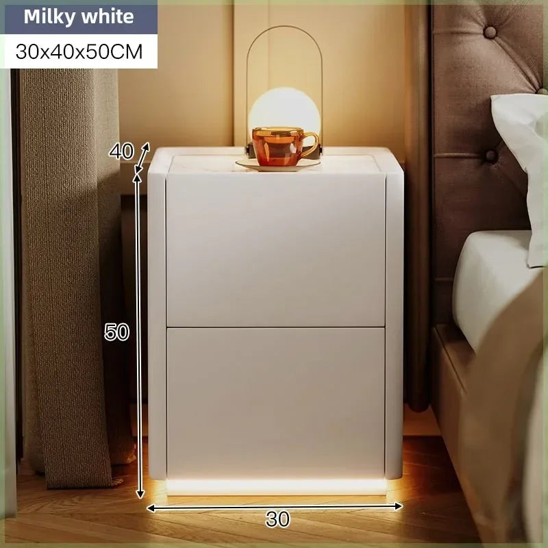 Milky white rustic nightstand in a bedroom, with a lamp and cup on top, showcasing its dimensions (30x40x50CM).