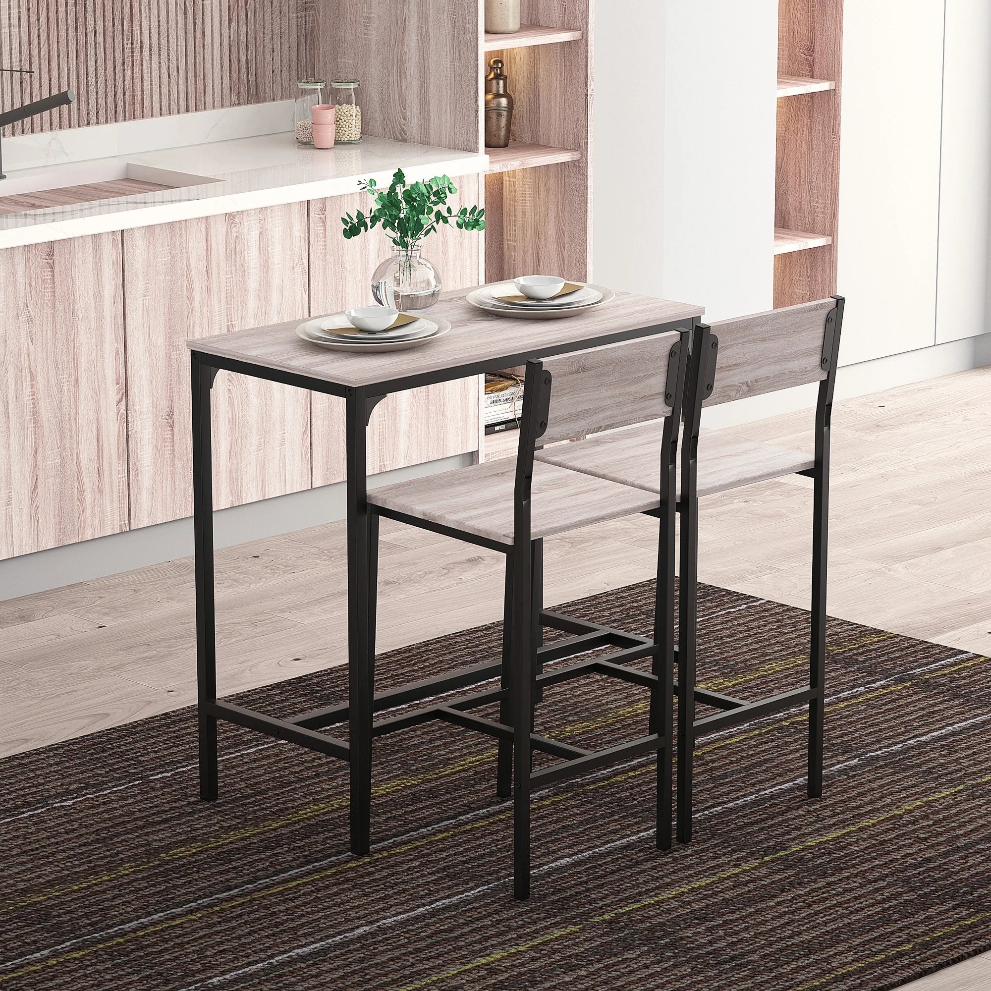 Compact grey wood grain table with two matching stools in a modern kitchen setting, ideal for small spaces.