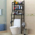 Black 3-tier over toilet storage rack with toiletries & towels in a modern bathroom, space-saving organiser