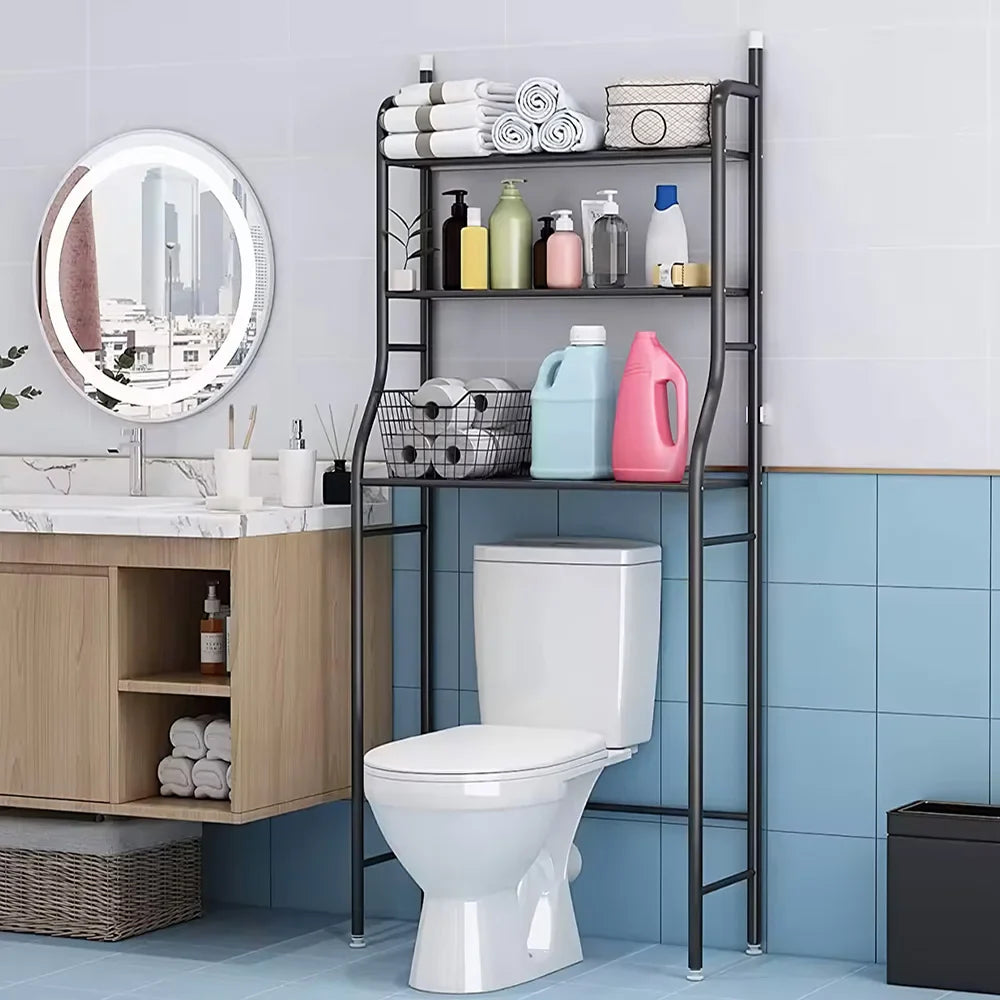 Black 3-tier over toilet storage rack in a modern bathroom with toiletries and towels