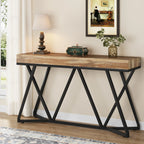 55-inch industrial console table with rustic wood-effect top and black metal geometric base in an entryway