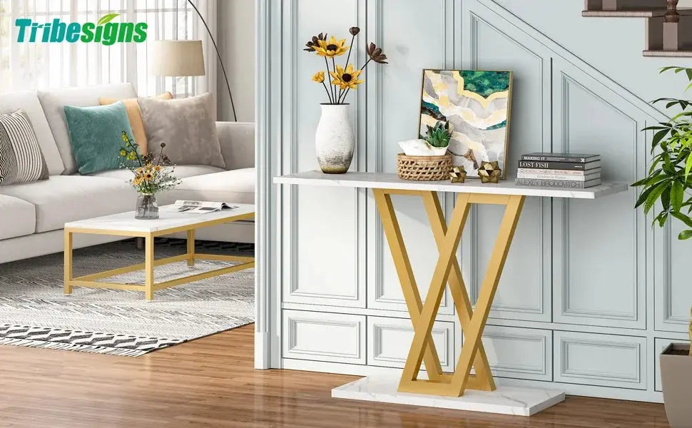 Tribesigns Industrial Console Table with white marble-effect top and gold X-shaped metal legs in a living room.