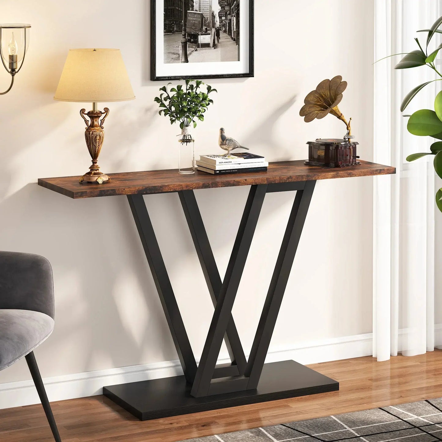 Tribesigns Industrial Console Table with dark wood top and black V-shaped metal base in a living room.