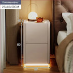 Champagne gray nightstand with measurements 25x40x50CM, featuring modern design with bottom lighting next to a bed.