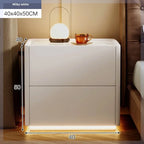 Milky white modern nightstand 40x40x50CM, with two drawers, a lamp, and a cup on top. Ideal for bedrooms.