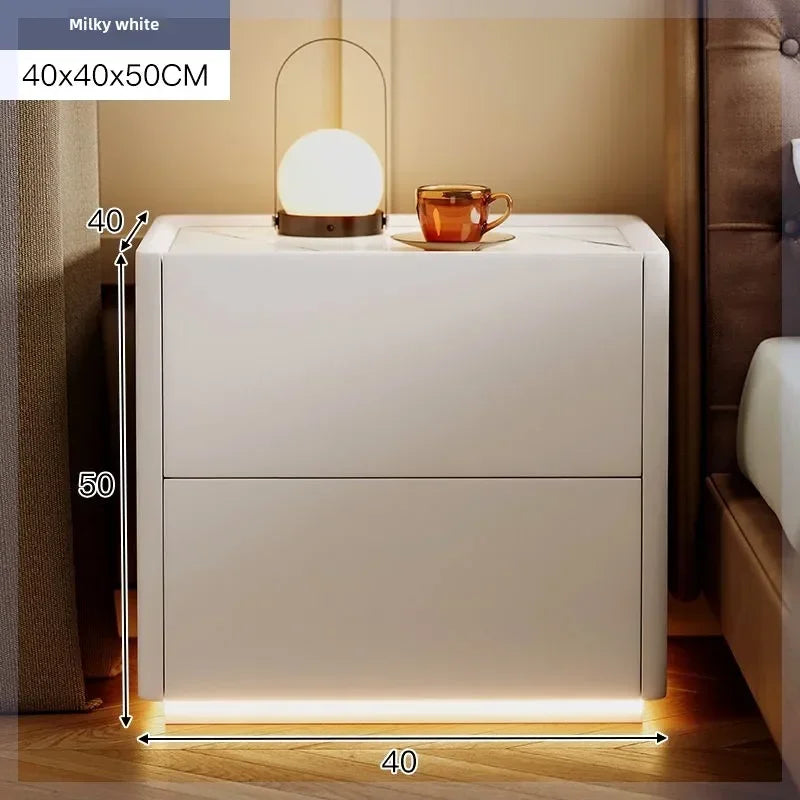 Milky white modern nightstand 40x40x50CM, with two drawers, a lamp, and a cup on top. Ideal for bedrooms.