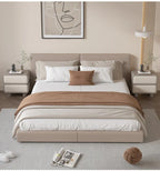 Modern Moroccan bedside table with two drawers, shown in a bedroom with a bed and rug. Perfect for storage.