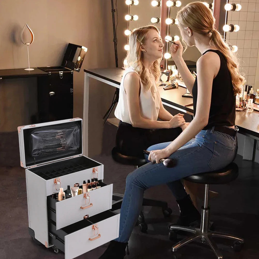 Professional rolling makeup case in white with drawers open, holding cosmetics, used by a makeup artist.