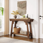 Rustic brown 2-tier entryway table with storage in a cosy hallway, decorated with a vase, candles, and woven baskets