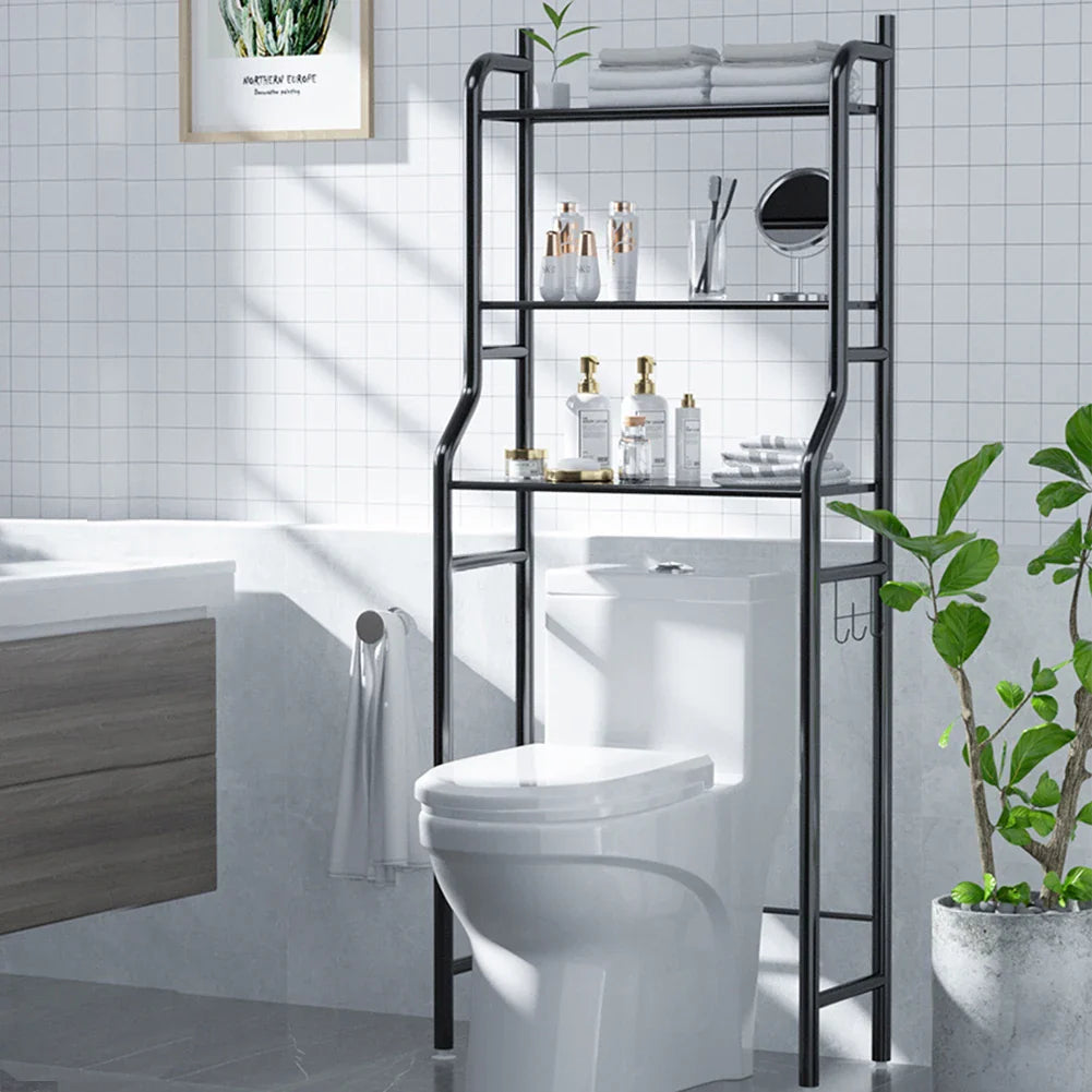 Black 3-tier over toilet storage rack with toiletries in a modern bathroom, perfect for space-saving organisation.