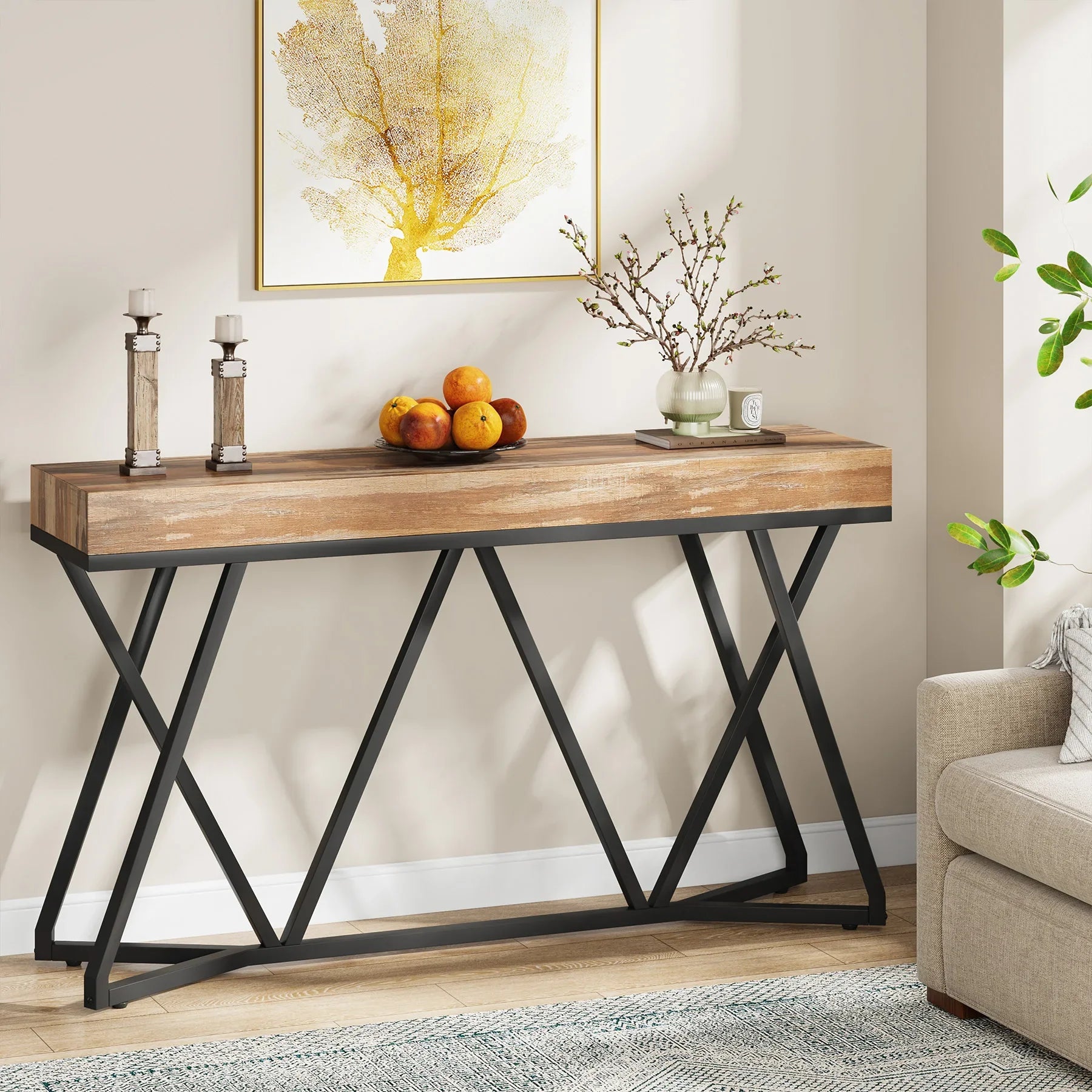 55 inch industrial-style console table with wood-effect top and black metal base in a living room setting