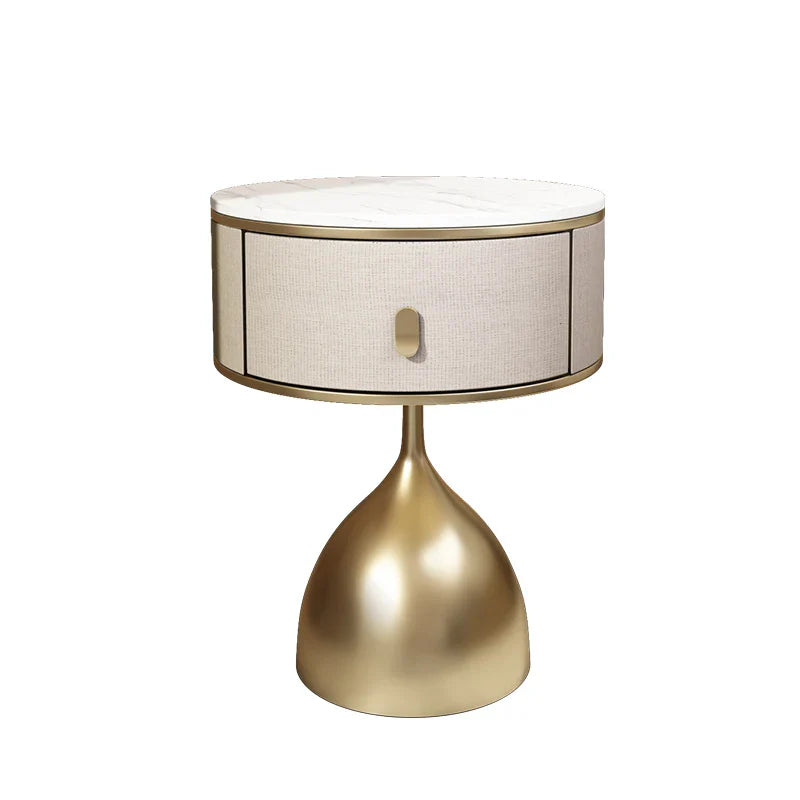 Luxury unique gold nightstand with round marble top, fabric drawer, and modern brass base for elegant bedroom.