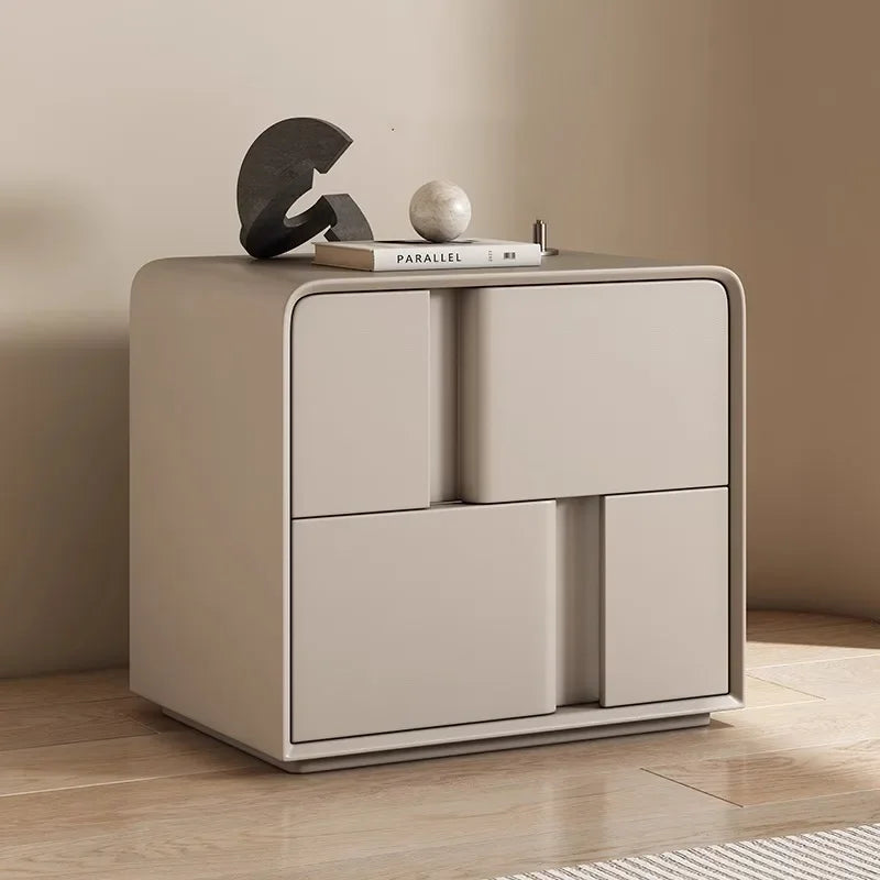 Modern beige double-layer storage bedside table with creative minimalist drawers and rounded edges on a wooden floor
