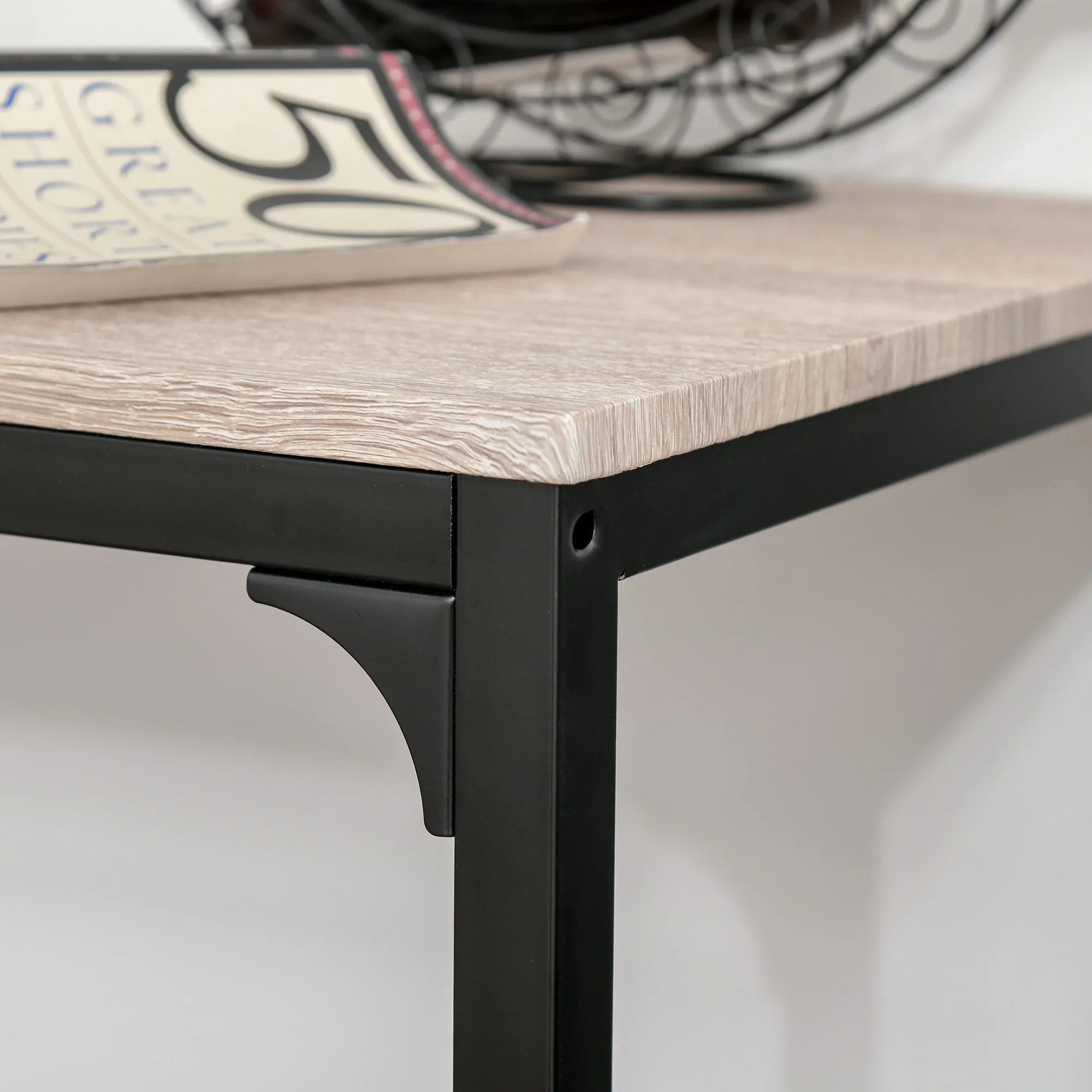 Close-up of HOMCOM Table Stool Set tabletop with light wood effect and black metal frame, showing detail and texture.