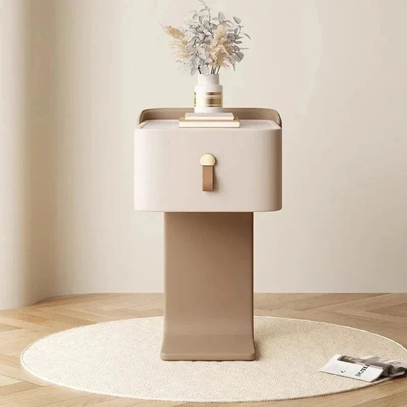 Minimalist Japanese nightstand with one drawer, cream top, brown base, and sleek leather pull handle.