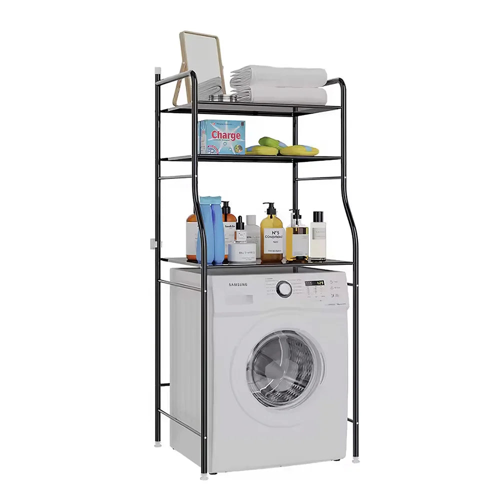Black 3-tier over toilet storage rack with toiletries and towels, above a white washing machine.
