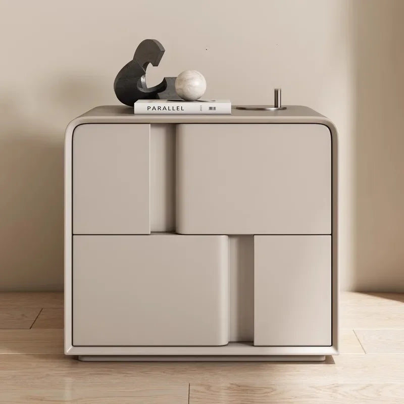 Modern double-layer storage bedside table in light grey with decorative items on top