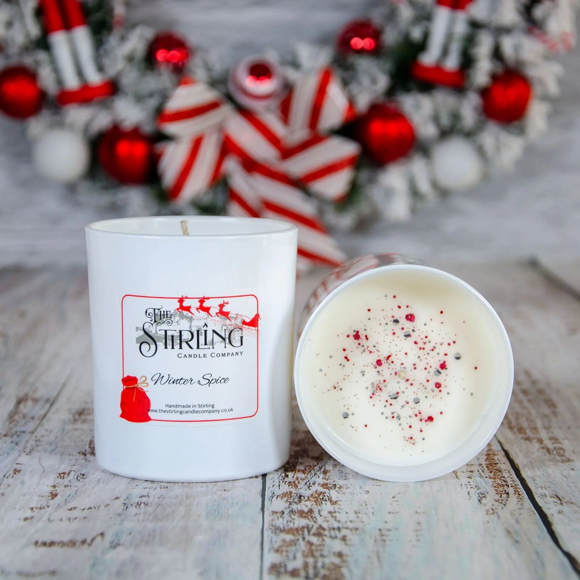 Winter Spice large candle, white container, with festive red and grey sprinkles on top, made in Stirling, Scotland
