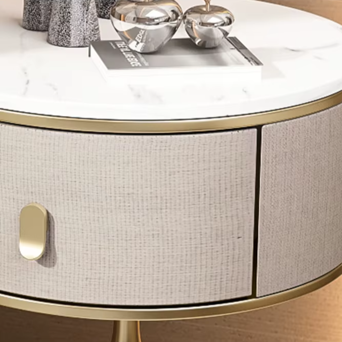 Close-up of a Luxury Unique Gold Nightstand with white marble top, gold trim, and light grey textured drawer