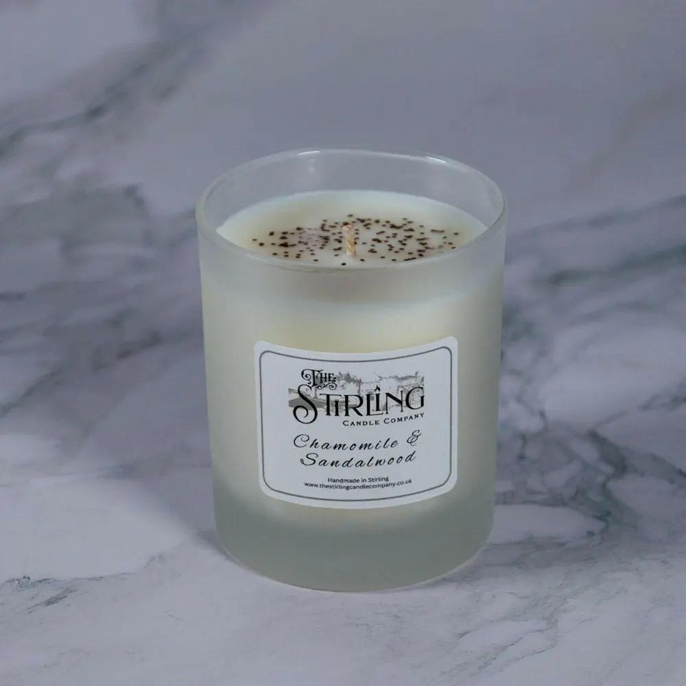 Chamomile & Sandalwood medium candle in frosted glass jar, hand-poured in Stirling, Scotland, with visible wax.