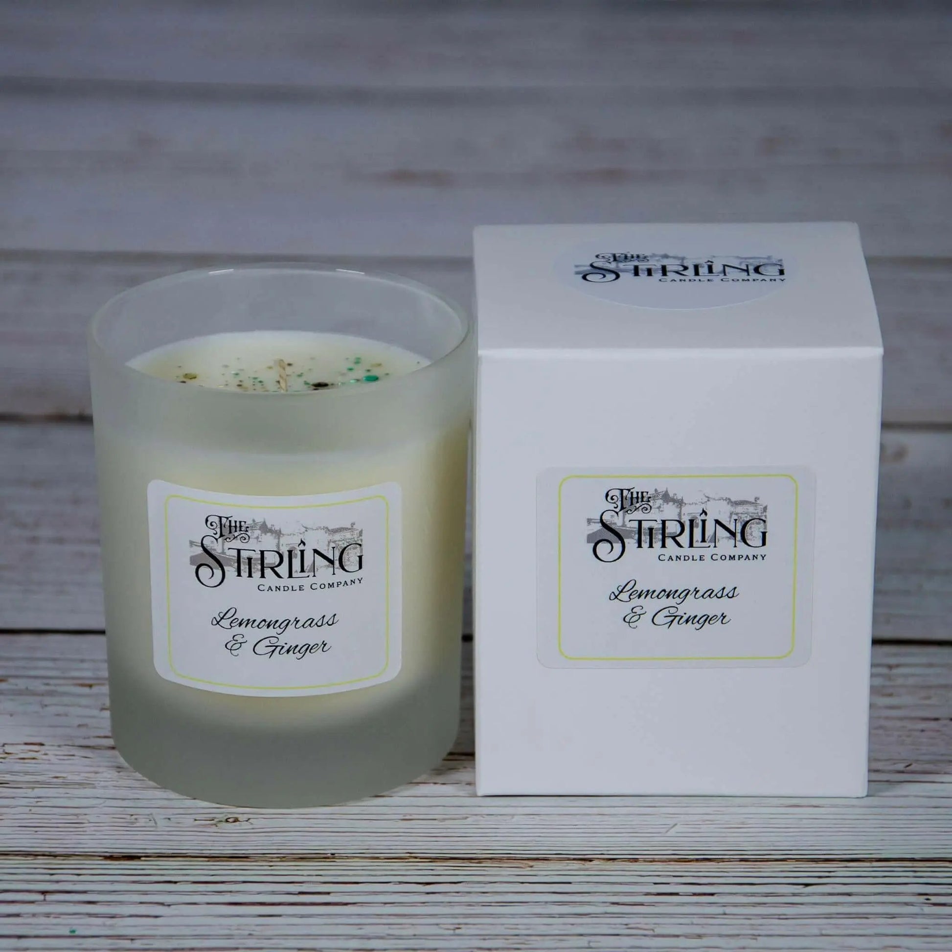 Lemongrass & Ginger medium candle with white label and matching white box, both displaying Stirling Candle Company branding.